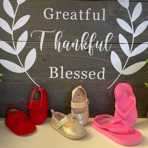 A BUNDLE OF BABY SHOES AND FLIP FLOP